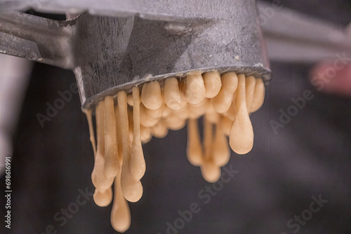 Preparation of Spätzle - Spaetzle, a Swabian type of noodle, preparation of food. photo
