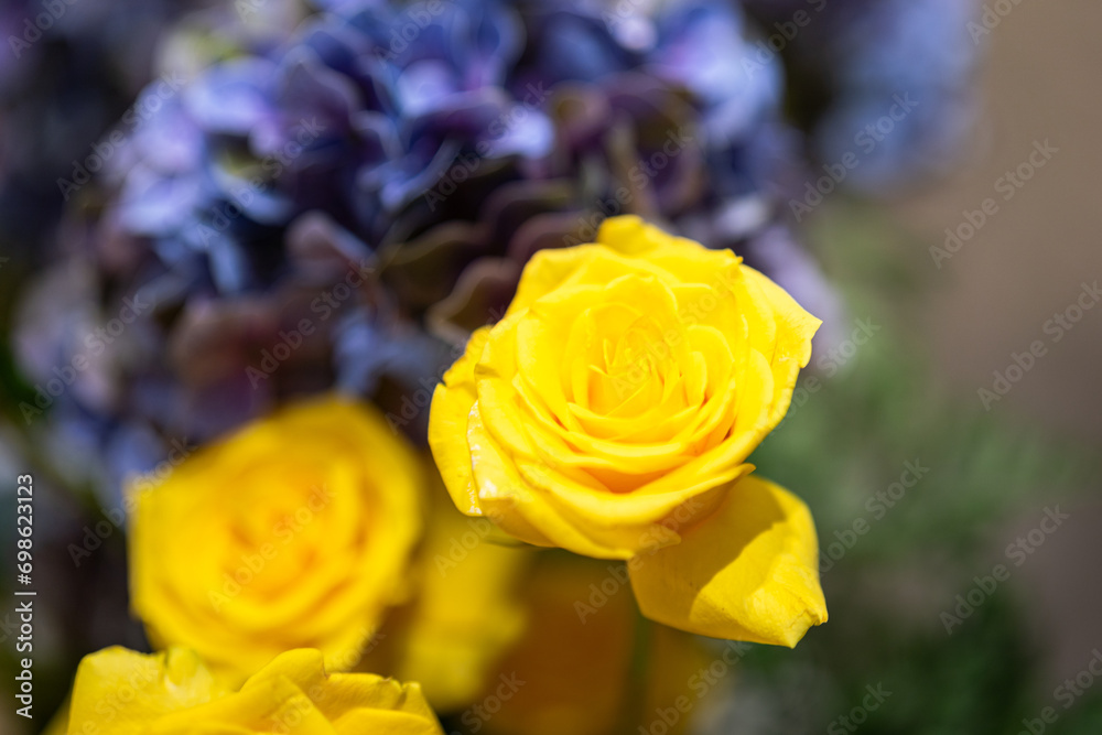 Close-up at yellow rose flower lube which is arranged as flower buch for wedding interior decoration. Selective focus. Close-up at yellow rose flower lube which is arranged as flower buch for wedding interior decoration. Selective focus.