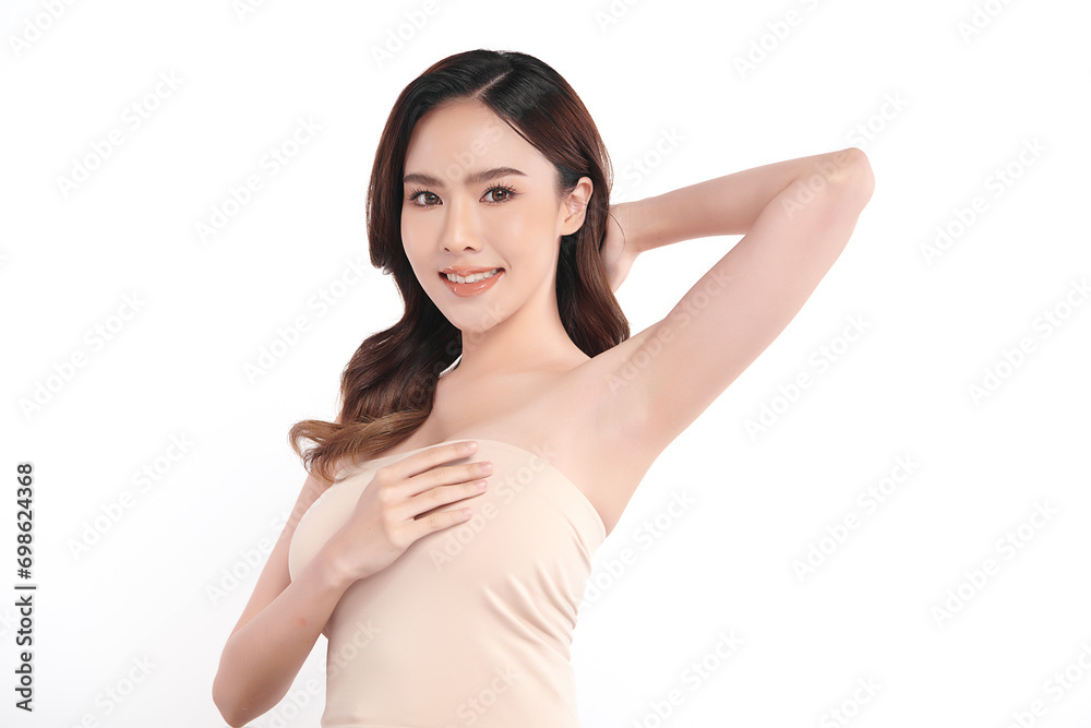 Beautiful Young Asian woman lifting hands up to show off clean and hygienic armpits or underarms on white background, Smooth armpit cleanliness and protection concept Beautiful Young Asian woman lifting hands up to show off clean and hygienic armpits or underarms on white background, Smooth armpit cleanliness and protection concept