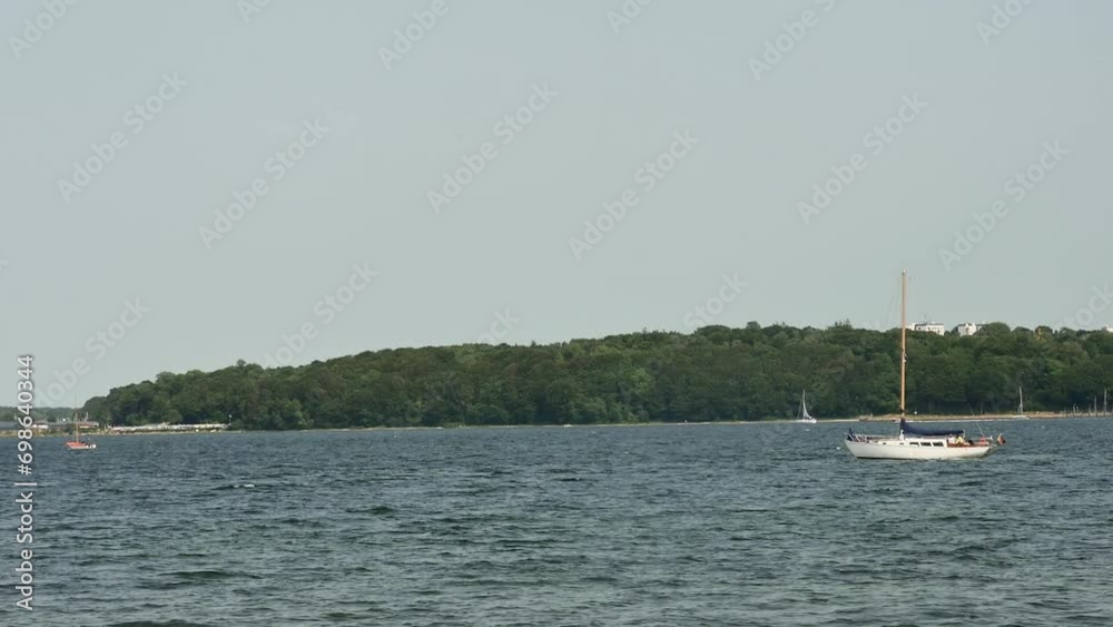 swinging on the waves in one place sailboat in the harbor swinging on the waves in one place sailboat in the harbor