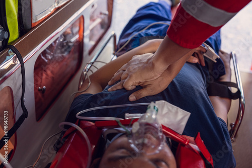 male paramedics are resuscitating To save cardiovascular lives, the rescue team uses their hands to perform CPR to save the lives of patients lying in the ambulance 