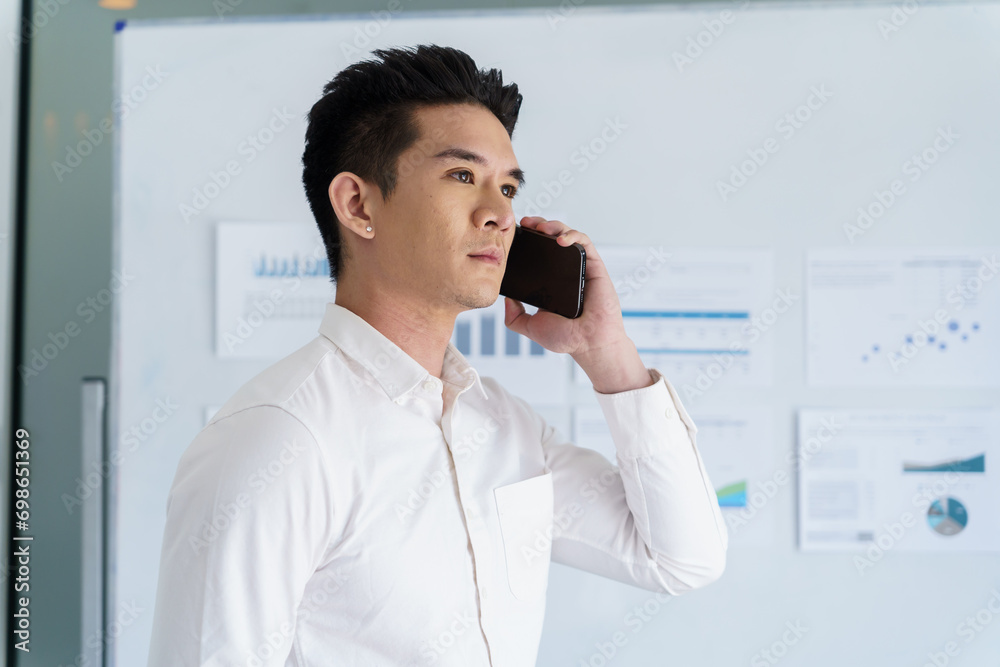 Asian Business man working with laptop. Young business man thinking Concentrated at work Asian Business man working with laptop. Young business man thinking Concentrated at work