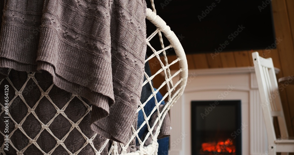 Person rocking in chair by fireplace, embodying solitude. Cozy setting highlights sense of seclusion, ideal for themes of solitude. Video portrays serene isolation, perfect for peaceful retreat. Person rocking in chair by fireplace, embodying solitude. Cozy setting highlights sense of seclusion, ideal for themes of solitude. Video portrays serene isolation, perfect for peaceful retreat.