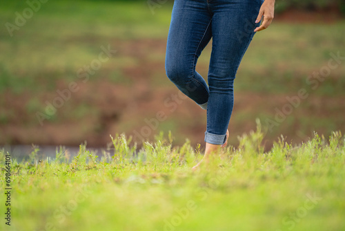 person walking on the grass