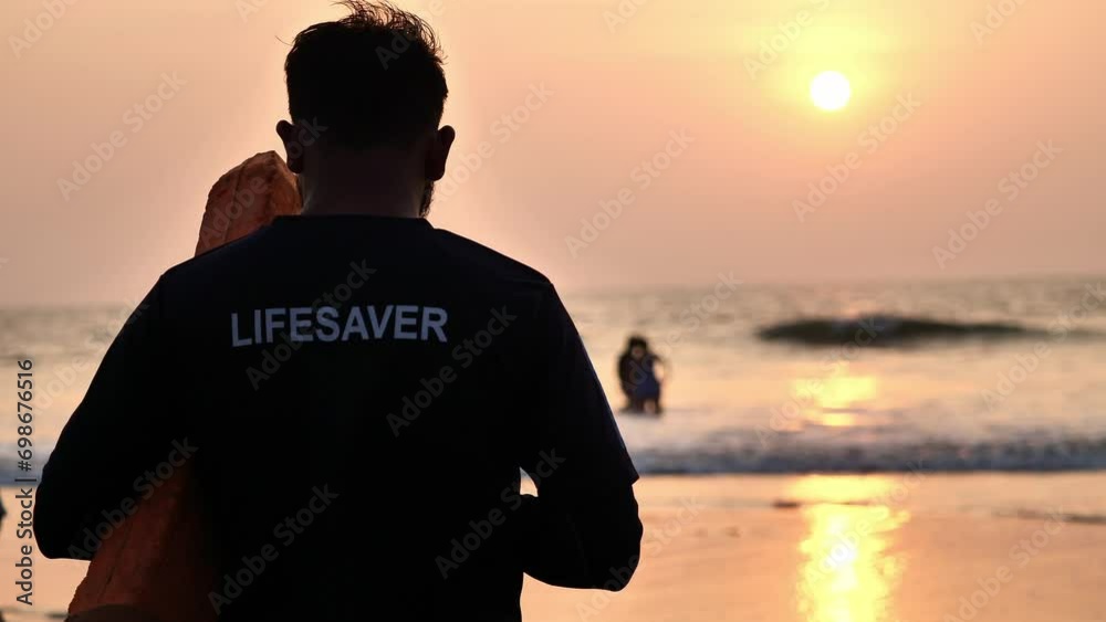 beach lifeguard keeps order in the ocean beach lifeguard keeps order in the ocean