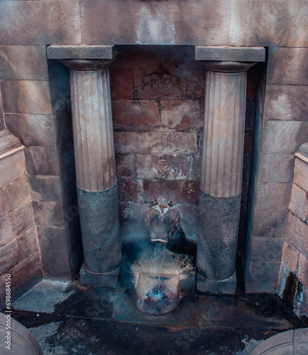Lion's fountain with thermal water in Catalonia, Spain. Caldes de Montbui Barcelona Province. Old fountain photo