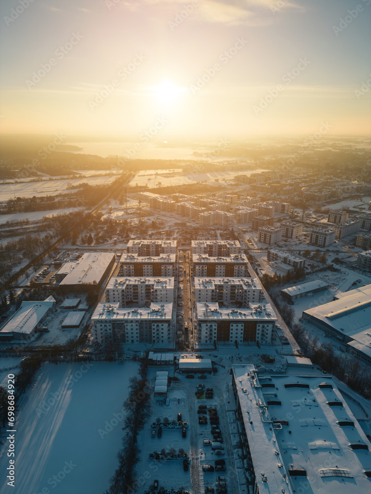 sunny winter over arctic town, sunset and snow at european city suburb residential district, snowfall at europe aerial - obrazy, fototapety, plakaty 