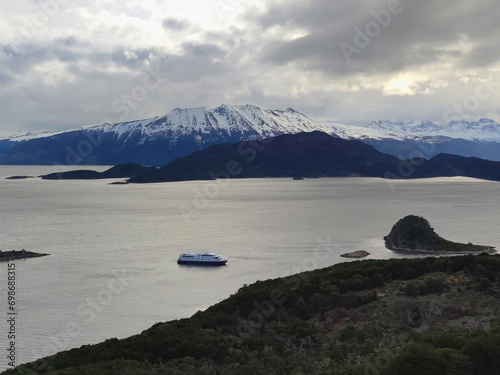 Coastline in Patagonia with a cruise ship, Tierra del Fuego, Argentina photo