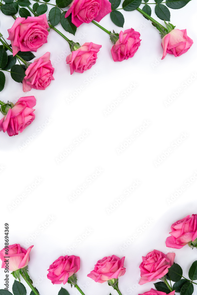 Bouquet of pink flowers roses on a white background with space for text. Top view, flat lay