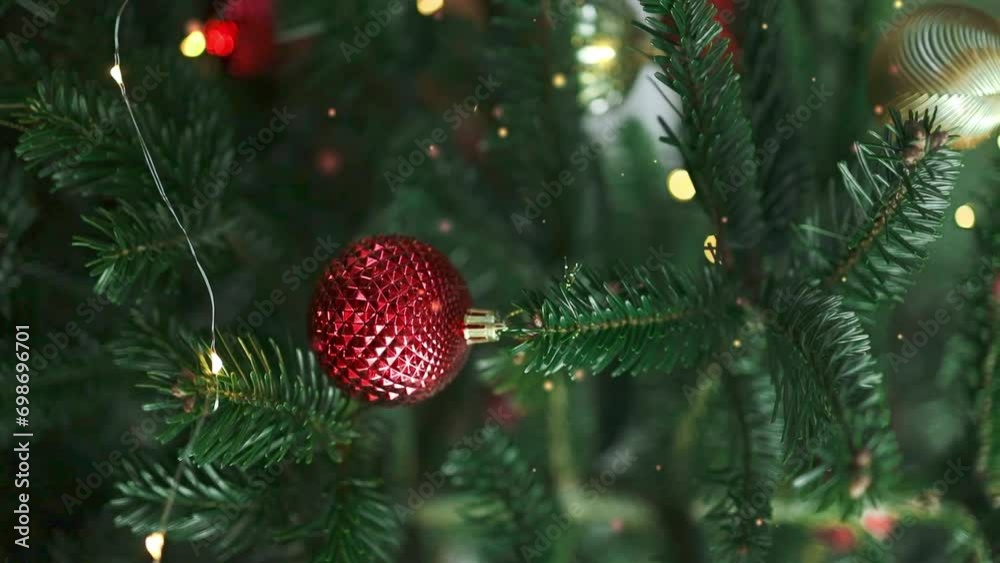 Close up of xmas balls on Christmas tree. Bokeh garlands in the background. New Year concept. Close up of xmas balls on Christmas tree. Bokeh garlands in the background. New Year concept.
