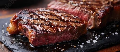 Close-up view of wagyu roast beef steak on black board