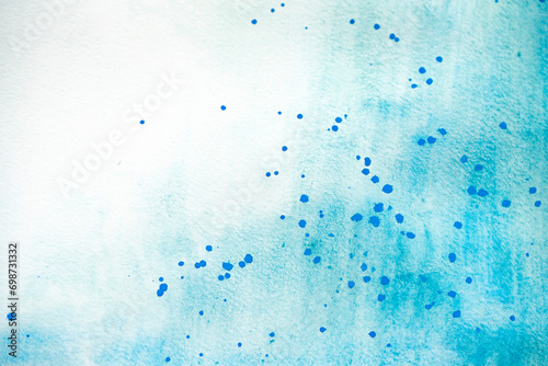 abstrakter Hintergrund in türkis mit blauen Farbspritzern und Sprenkeln, Aquarellfarbe photo