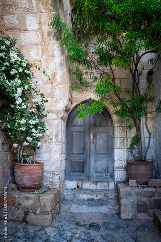 Old door in the fabulous Lindos city. Charming streets.