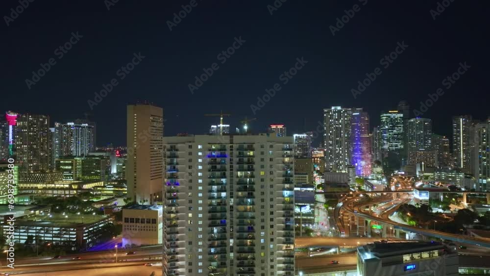 View from above of illuminated skyscraper buildings in downtown district of Miami Brickell in Florida, USA at night. American megapolis with business financial district at nightfall View from above of illuminated skyscraper buildings in downtown district of Miami Brickell in Florida, USA at night. American megapolis with business financial district at nightfall