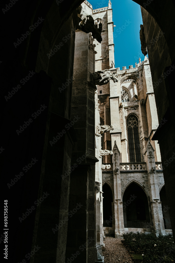 Old gargoyles on a Gothic style old cathedral church in Narbonne