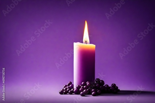 burning candle on purple background