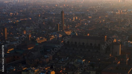 Aerial 4k footage of historical center of the city of bologna italy taken at sunrise in low light two towers maggiore square san petrinio basilica photo