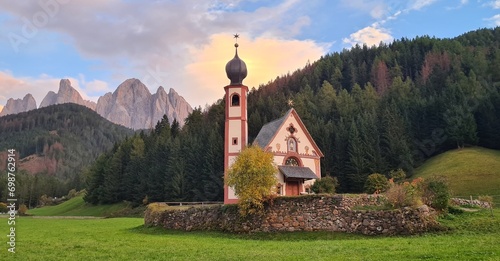 Beautiful Church of St John of Nepomuk , Dolomites, South Tyrol. Famous best alpine place of the world, Santa Maddalena (St Magdalena) village with magical Dolomites mountains in background, Val Funes photo