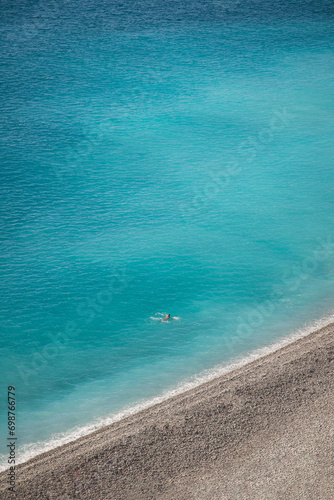 Fototapeta Naklejka Na Ścianę i Meble -  man swimming in the blue ocean