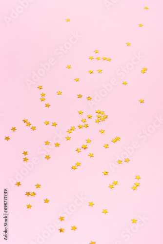 Sparkle stars shape on a pink background. Happy new year background