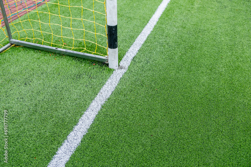 detail of the surface of an artificial grass soccer field photo