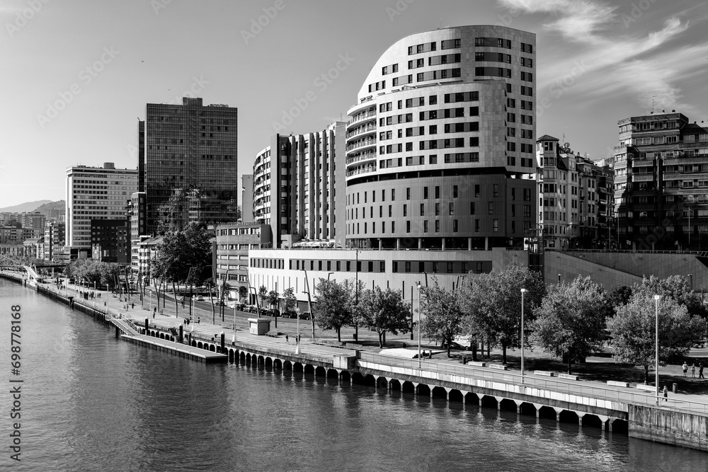View of the Nervion river crossing the city of Bilbao in the Basque Country. Spain. Black and white.