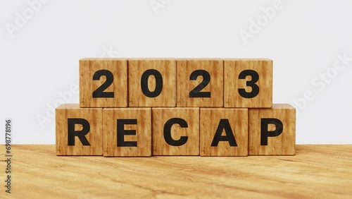 2023 Recap economy, business, financial summary, business review concept. Business plan for 2024. 2023 Recap on wooden cubes. 4k 3d animation photo