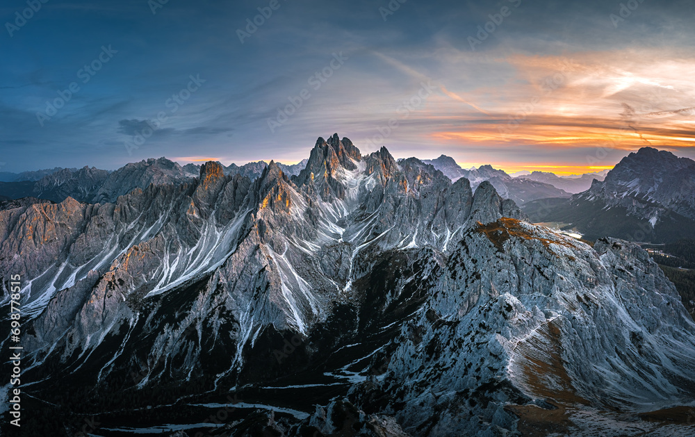 Stunning sunset with colorful sky at Italian Dolomites. Impressive Cadini di Misurina mountain range in autumn colors.