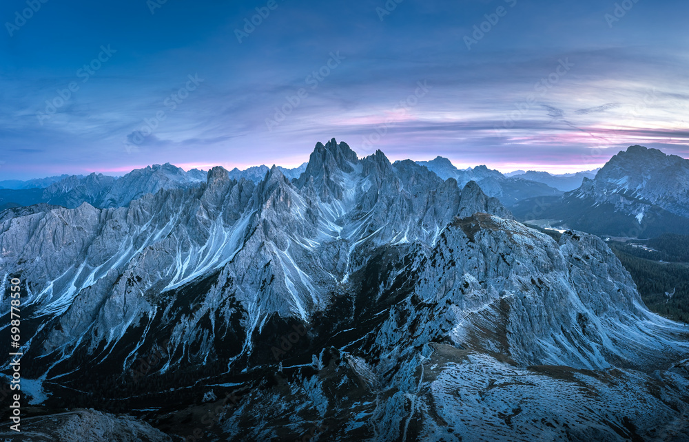 Stunning sunset with colorful sky at Italian Dolomites. Impressive Cadini di Misurina mountain range in autumn colors.
