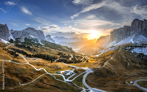 Obraz na płótnie Italian Dolomites in colorful golden sunrise. Misty Alpine mountains in haze. Silhouettes of mountain peaks. w salonie