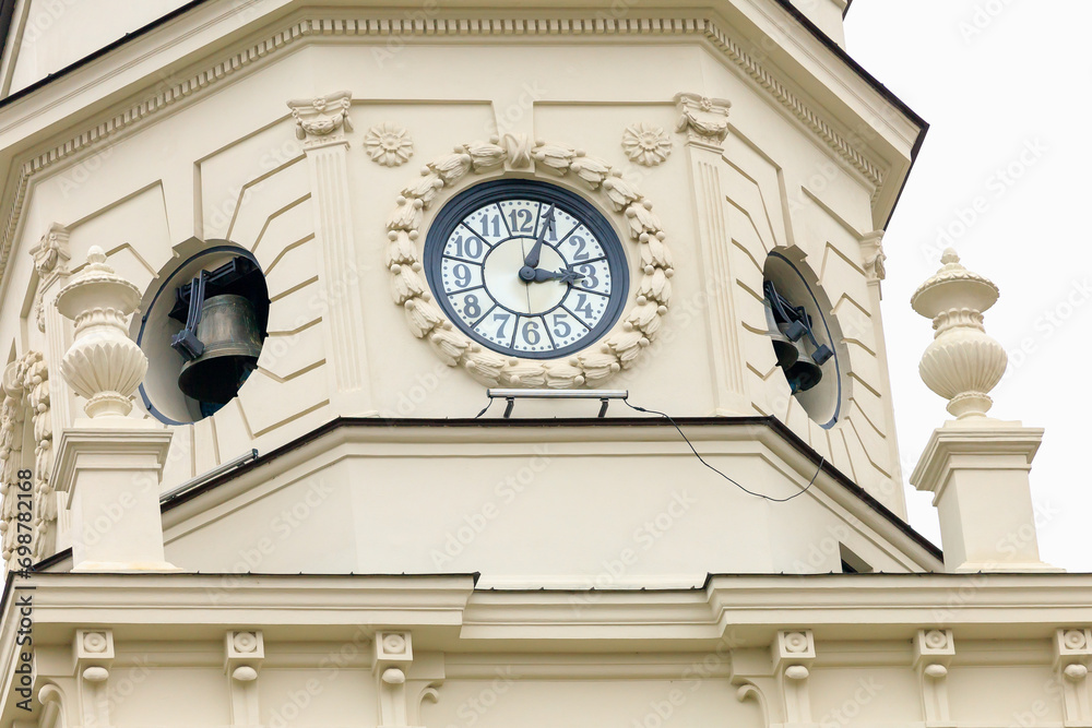 Ancient clock on the city tower. Background with selective focus and copy space