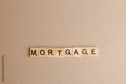 MORTGAGE word is written on wood block. MORTGAGE text on cement table for your design, concept