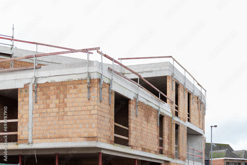 New building in progress, construction of apartments, construction started, building in shell, apartment prices, construction works,New building in progress,Bricks and concrete