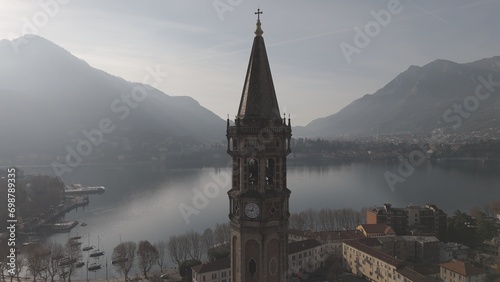 the Basilica of San Nicolo is located in the heart of Lecco, in an elevated position near lake Como at Christmas time and the statue of Mario Cermenati. 