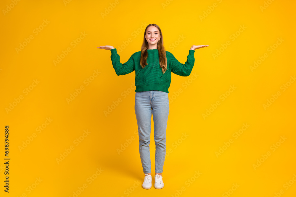 Full body size photo of attractive young model girlfriend comparing two boyfriends candidate hold arms isolated on yellow color background