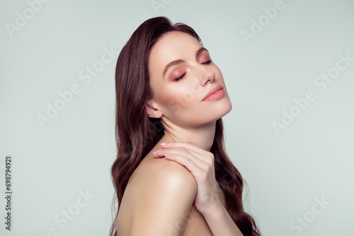 Photo portrait of lovely young lady touch shoulder enjoy procedure spa salon isolated on light gray color background