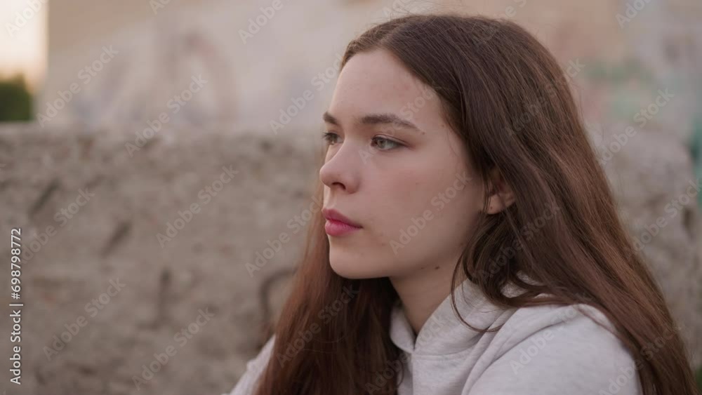 Lady grapples with life difficulties among concrete rocks. Depressed young woman struggles coping with negative emotions. Addressing mental health issues Lady grapples with life difficulties among concrete rocks. Depressed young woman struggles coping with negative emotions. Addressing mental health issues
