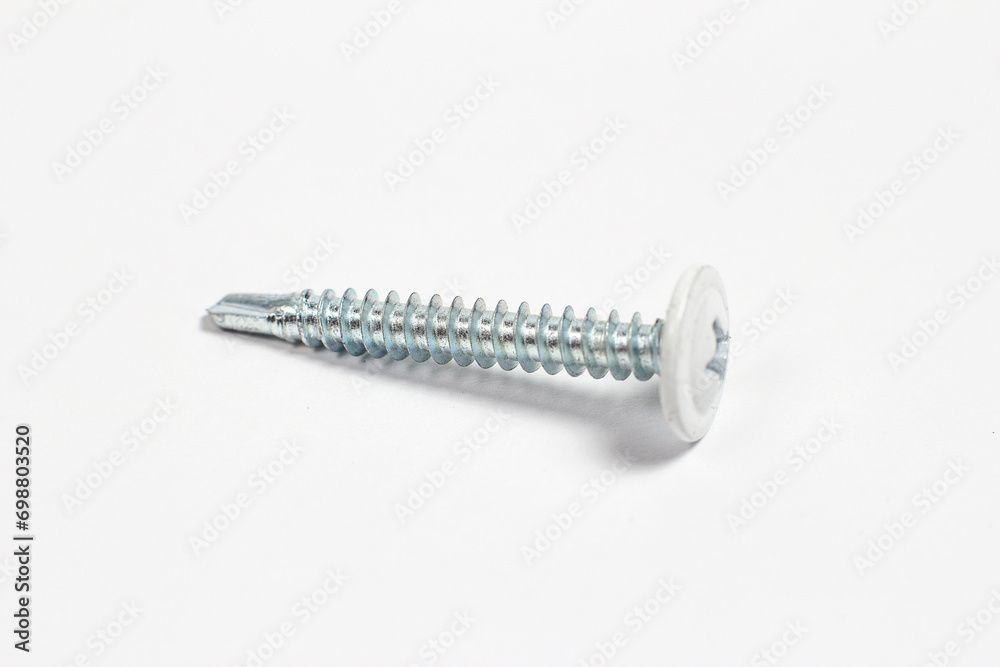 Self-tapping screws for construction on a white background Self-tapping screws for construction on a white background