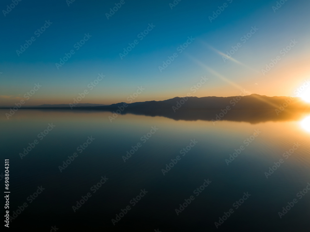 Aerial view over Salton sea in California. Huge lake in the middle of a desert at sunset.