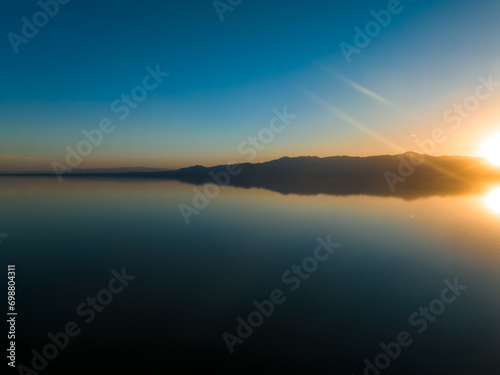 Aerial view over Salton sea in California. Huge lake in the middle of a desert at sunset. © Aerial Film Studio