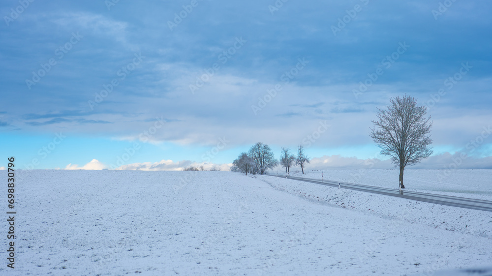 Winter snowy landscape with blue beautiful sky. Winter weather.Winter frosty wallpaper. Winter nature. Natural texture. 
