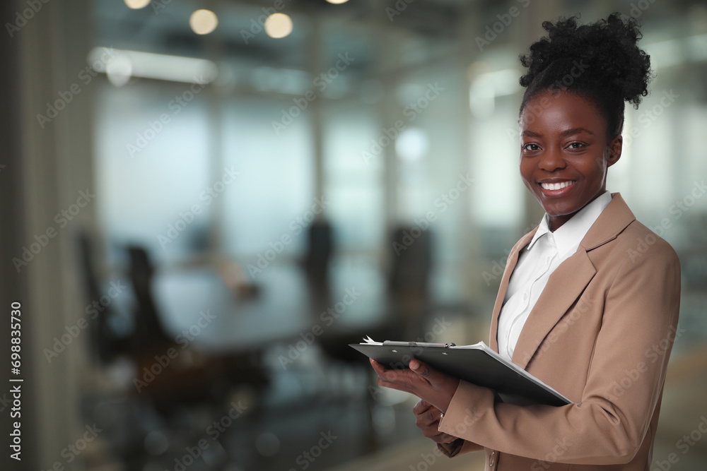 Lawyer, consultant, business owner. Confident woman with clipboard smiling indoors, space for text Lawyer, consultant, business owner. Confident woman with clipboard smiling indoors, space for text