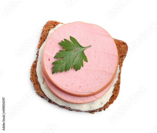 Delicious sandwich with boiled sausage, parsley and sauce isolated on white, top view