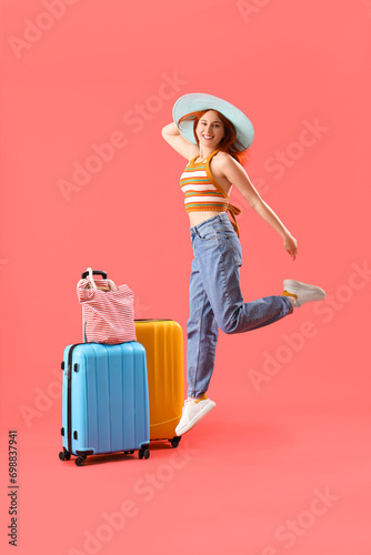 Jumping female tourist with...