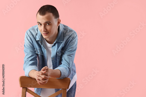 Young man with chair on pin...