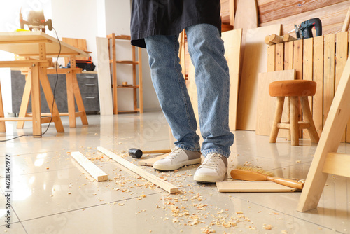 Mature carpenter with filin...