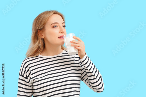 Mature woman drinking milk ...