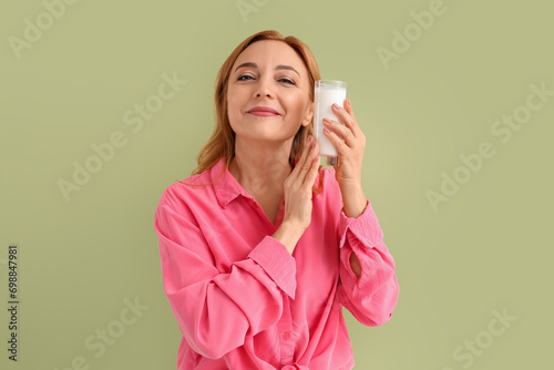 Mature woman with glass of ...