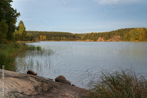 View from the shore of Lake Ladoga near the village of Lumivaara on a sunny autumn day, Ladoga skerries, Lahdenpohya, Republic of Karelia, Russia photo