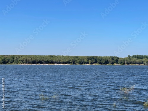 Obraz na plátně Beautiful riverscape on a windless early summer evening